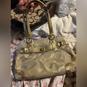 Gold coach shoulder bag